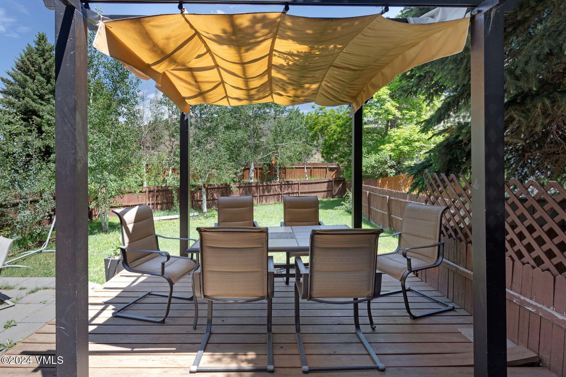 149 Deer Boulevard, Unit A Eagle-Vail, CO 81620 - Photo 5 of 22 a view of a patio with a table chairs and a patio