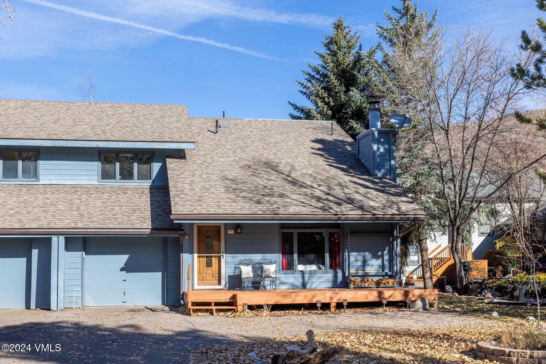 149 Deer Boulevard, Unit A Eagle-Vail, CO 81620 - Photo 6 of 22 a front view of a house with cars parked