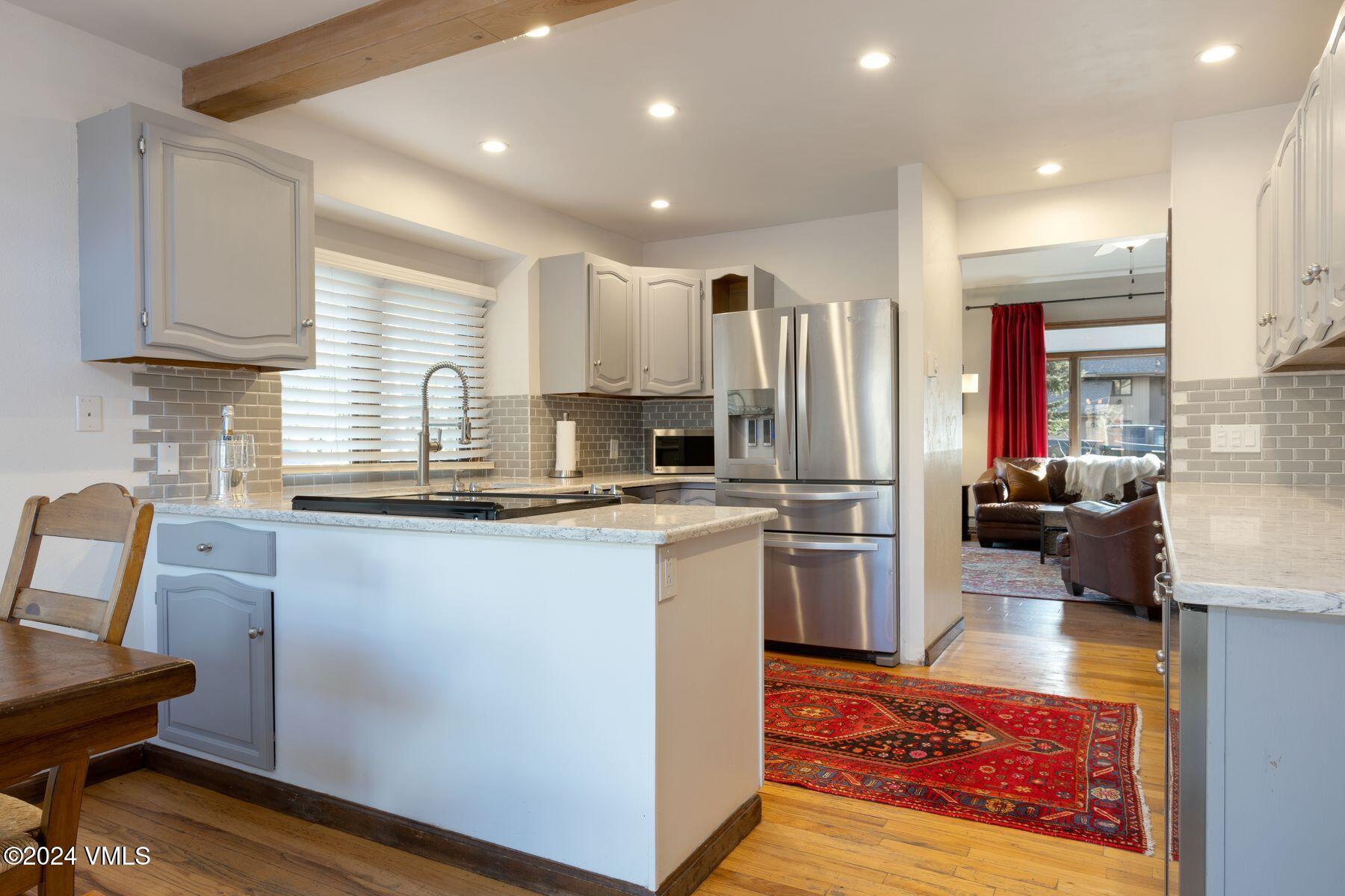 149 Deer Boulevard, Unit A Eagle-Vail, CO 81620 - Photo 8 of 22 a kitchen with refrigerator and cabinets