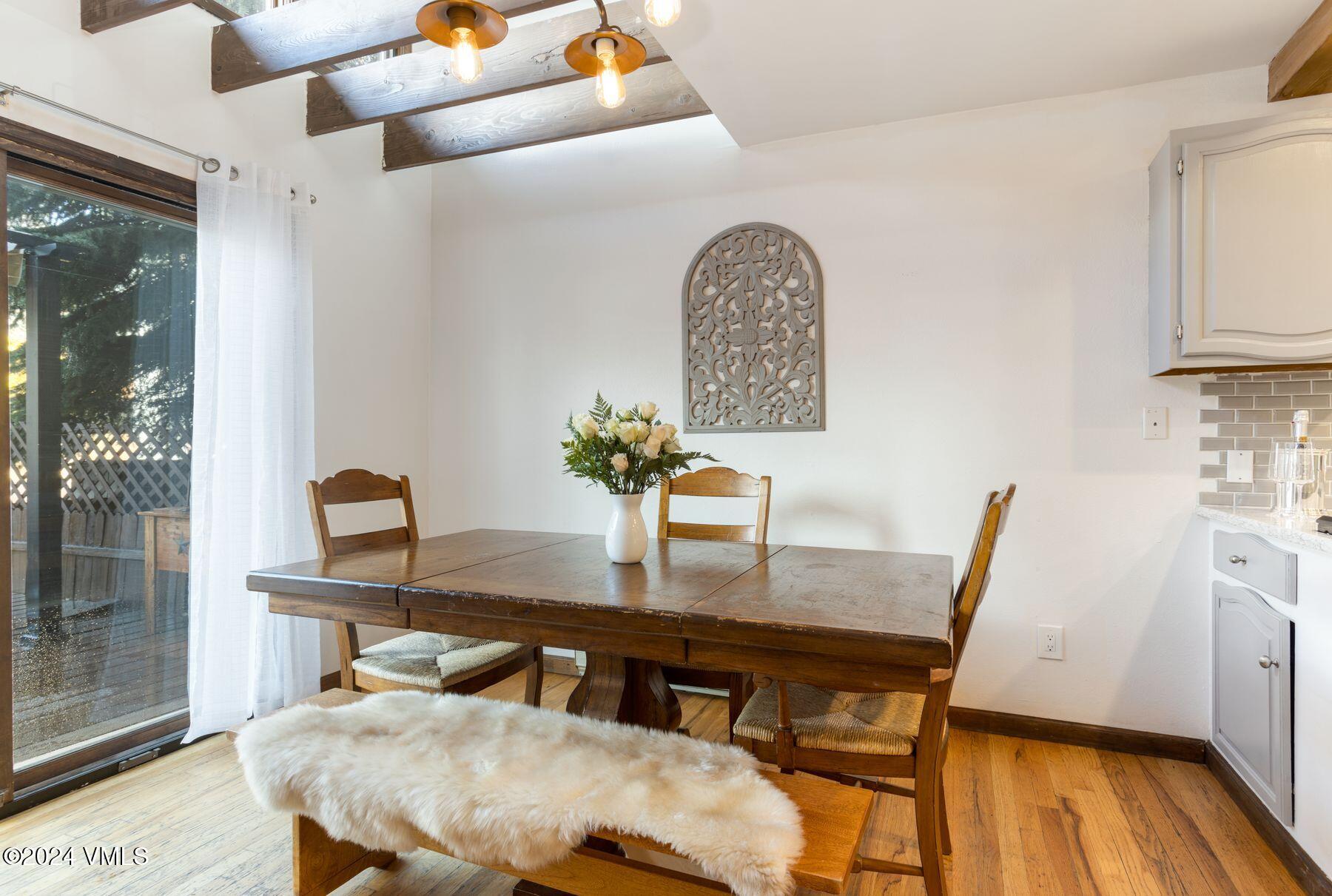 149 Deer Boulevard, Unit A Eagle-Vail, CO 81620 - Photo 9 of 22 a view of a dining room with furniture and wooden floor