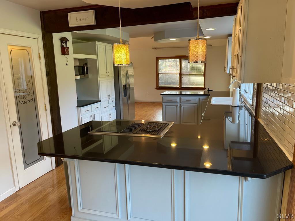 1377 Mill Road Bangor, PA 18013 - Photo 18 of 34 Breakfast Bar with built in downdraft stove!
