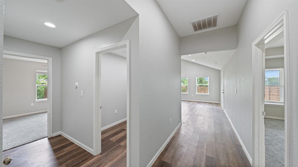 207 East McCoulskey Street Terrell, TX 75160 - Photo 11 of 29 wooden floor in a hall with an entryway