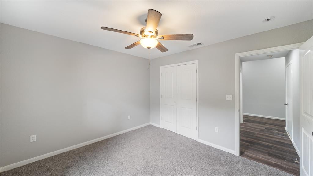 207 East McCoulskey Street Terrell, TX 75160 - Photo 13 of 29 wooden floor in an empty room with a window
