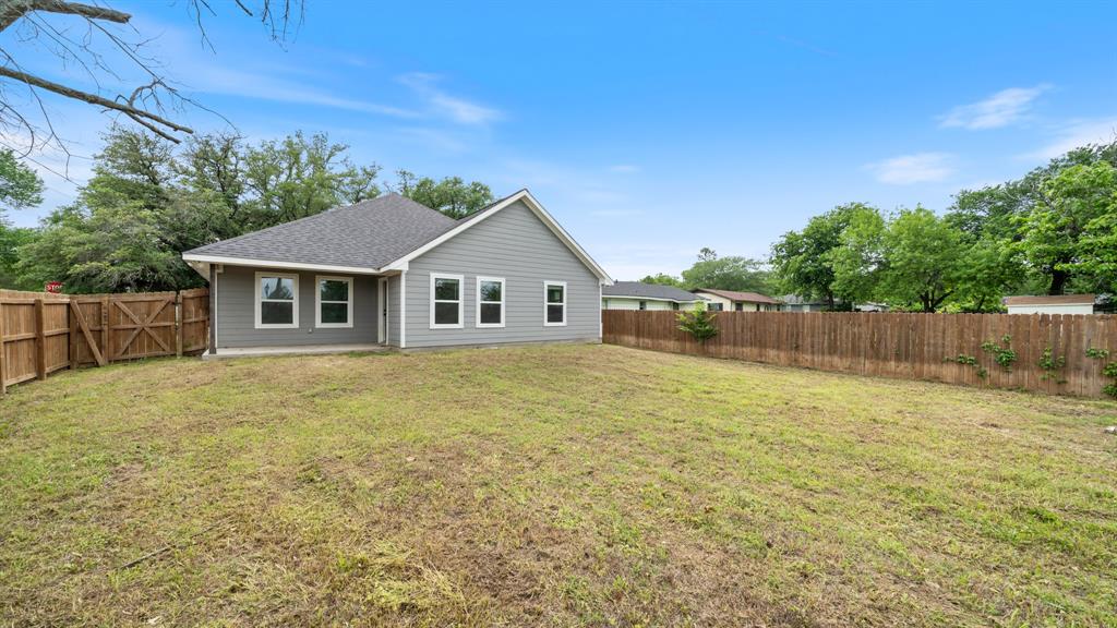 207 East McCoulskey Street Terrell, TX 75160 - Photo 24 of 29 a front view of a house with a yard