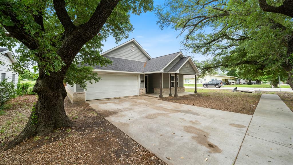 207 East McCoulskey Street Terrell, TX 75160 - Photo 25 of 29 a view of road and trees