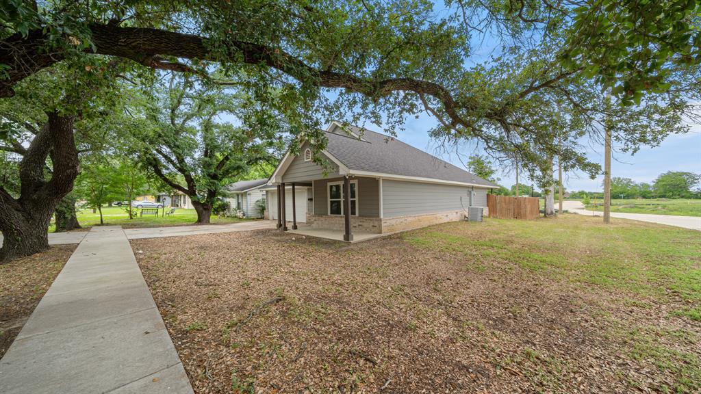 207 East McCoulskey Street Terrell, TX 75160 - Photo 27 of 29 a view of a house with a yard