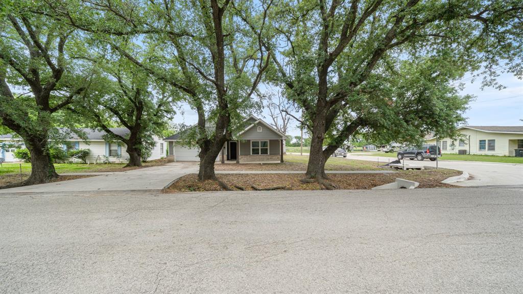 207 East McCoulskey Street Terrell, TX 75160 - Photo 29 of 29 a house with trees in front of it