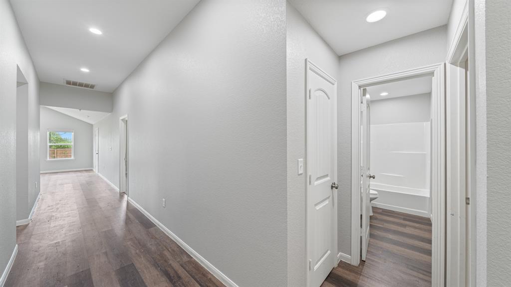 207 East McCoulskey Street Terrell, TX 75160 - Photo 3 of 29 a view of hallway with wooden floor