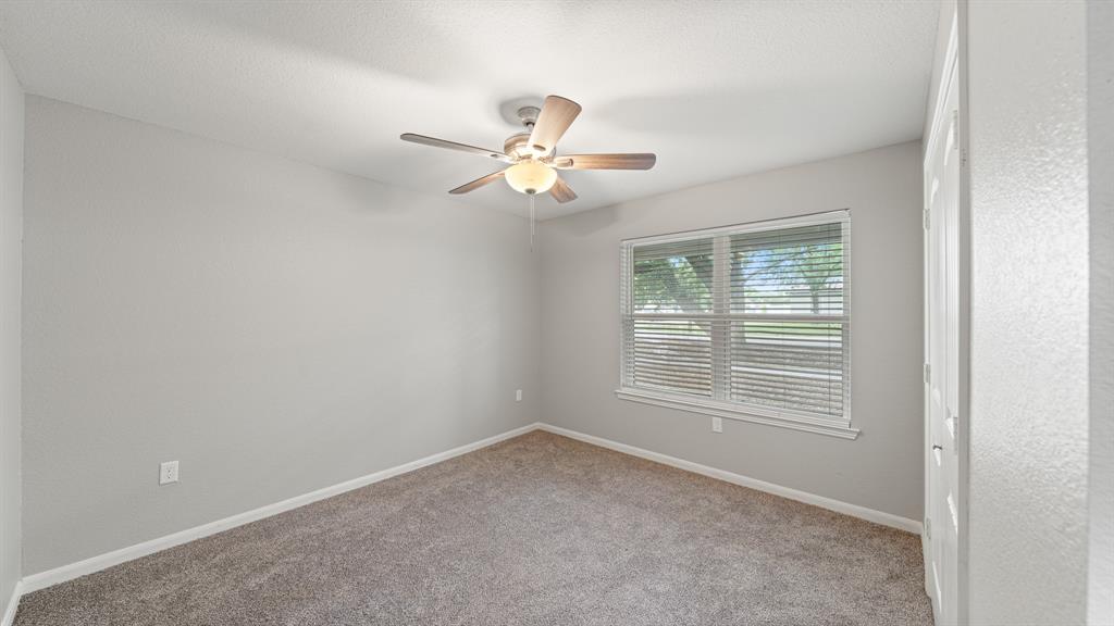 207 East McCoulskey Street Terrell, TX 75160 - Photo 9 of 29 a view of an empty room with a window