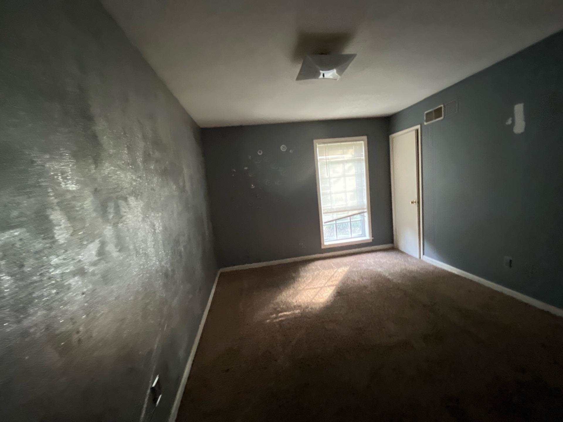 4149 Meadow Creek Road Memphis, TN 38115 - Photo 8 of 13 Carpeted empty room with visible vents and baseboards
