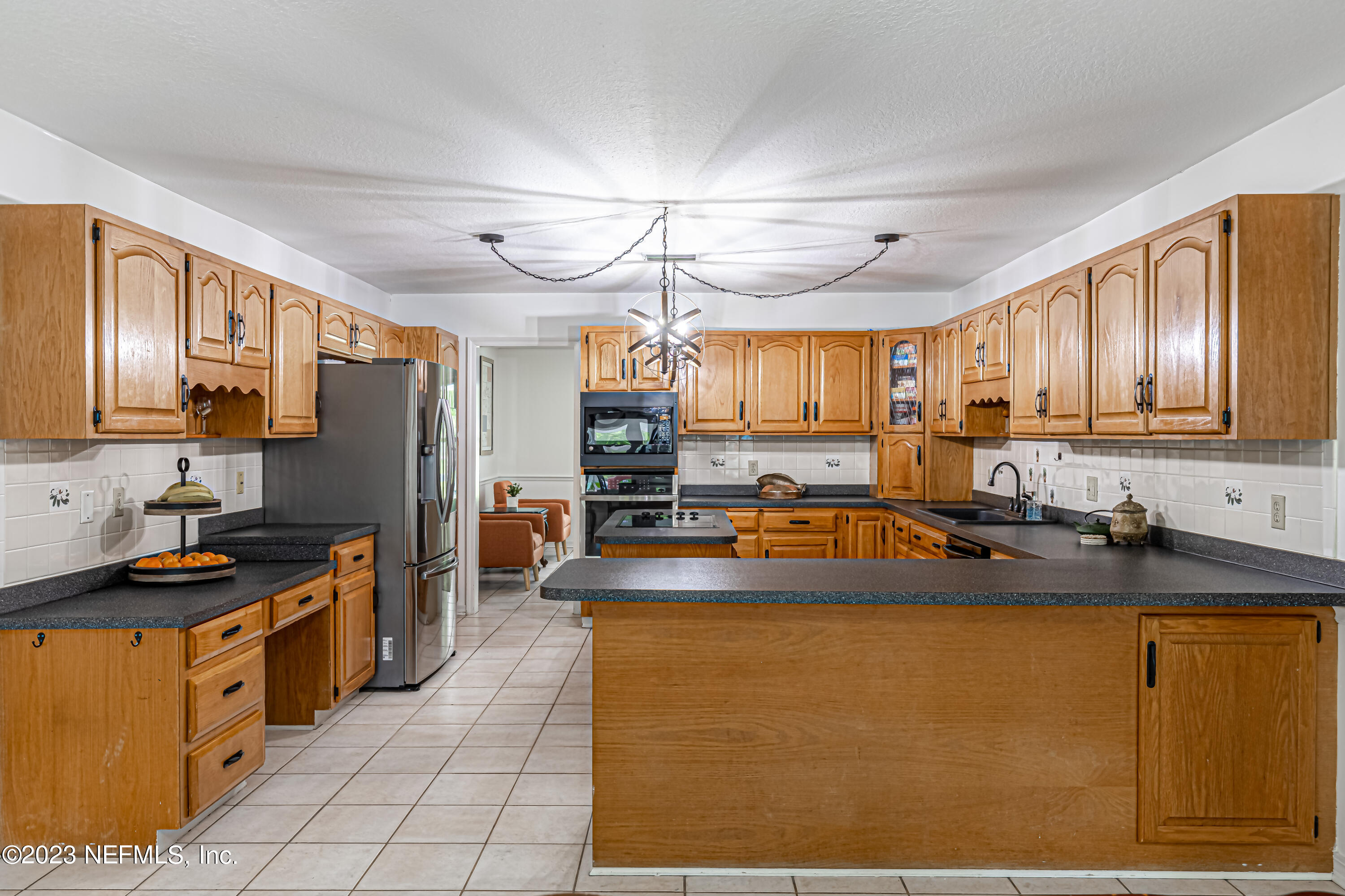 520 Roberts Road St. Johns, FL 32259 - Photo 13 of 81 a kitchen with stainless steel appliances granite countertop a sink stove and refrigerator