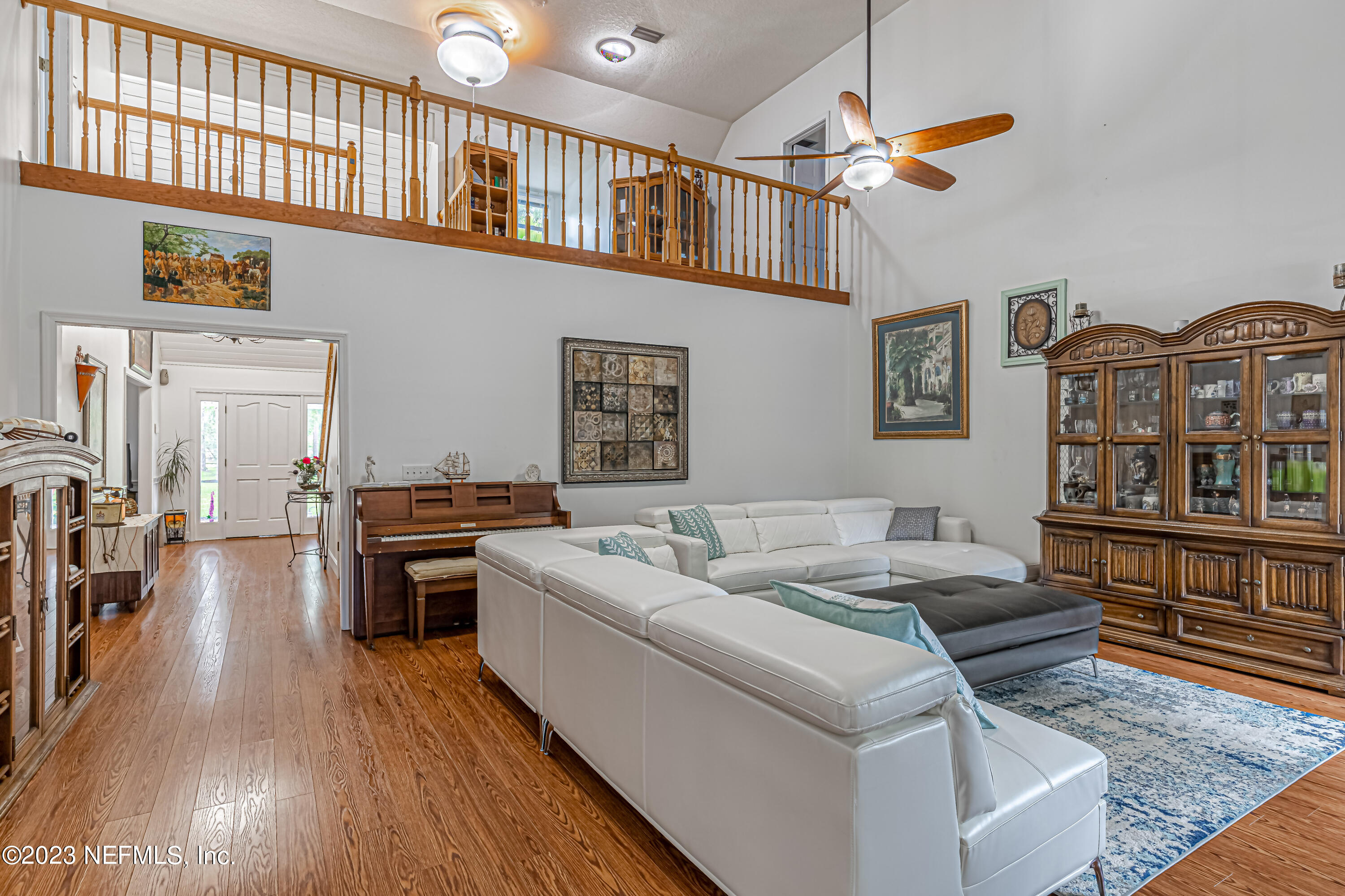 520 Roberts Road St. Johns, FL 32259 - Photo 18 of 81 a living room with couches a dining table and chairs with wooden floor