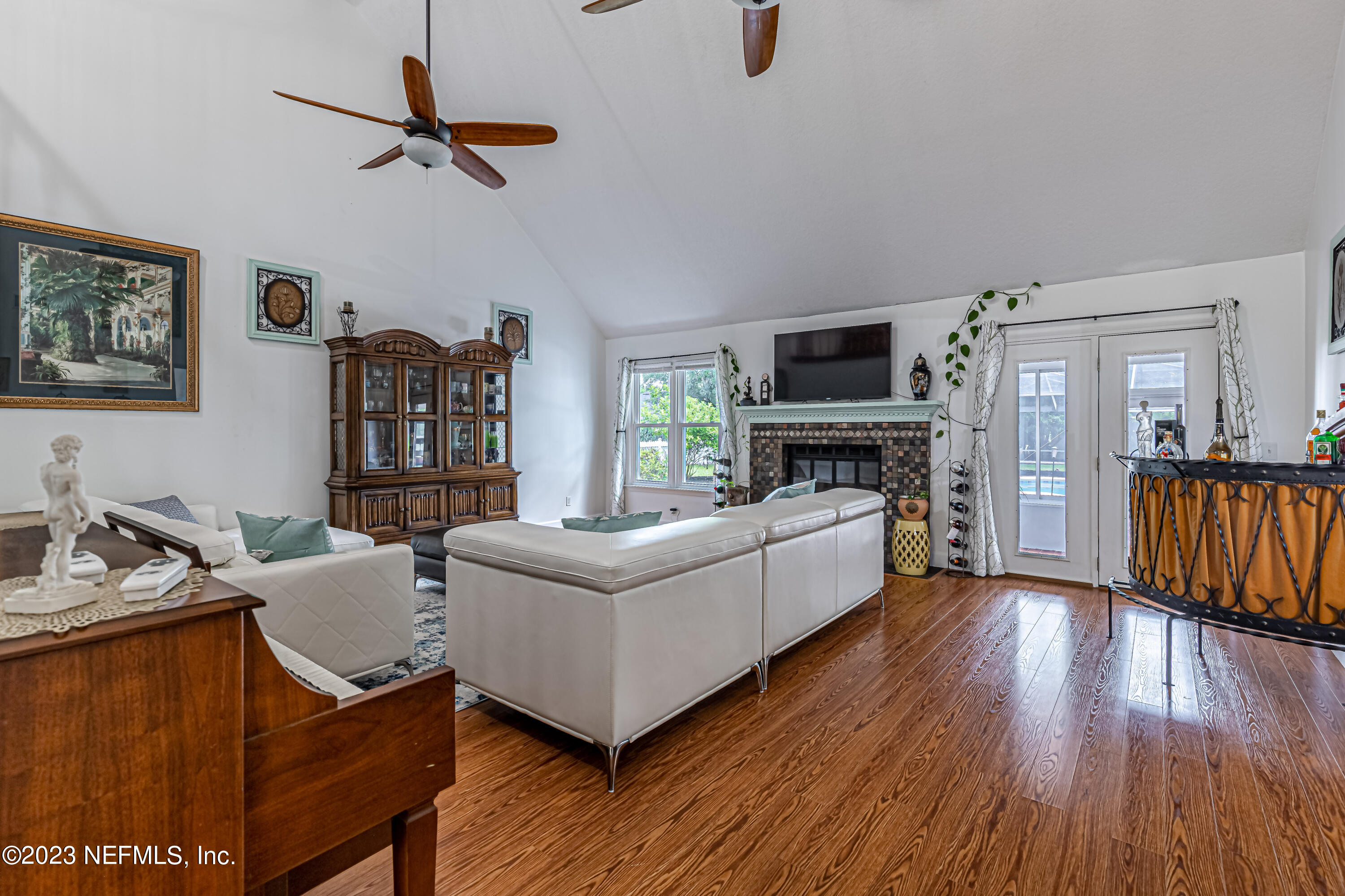 520 Roberts Road St. Johns, FL 32259 - Photo 20 of 81 a living room with furniture wooden floor and a fireplace