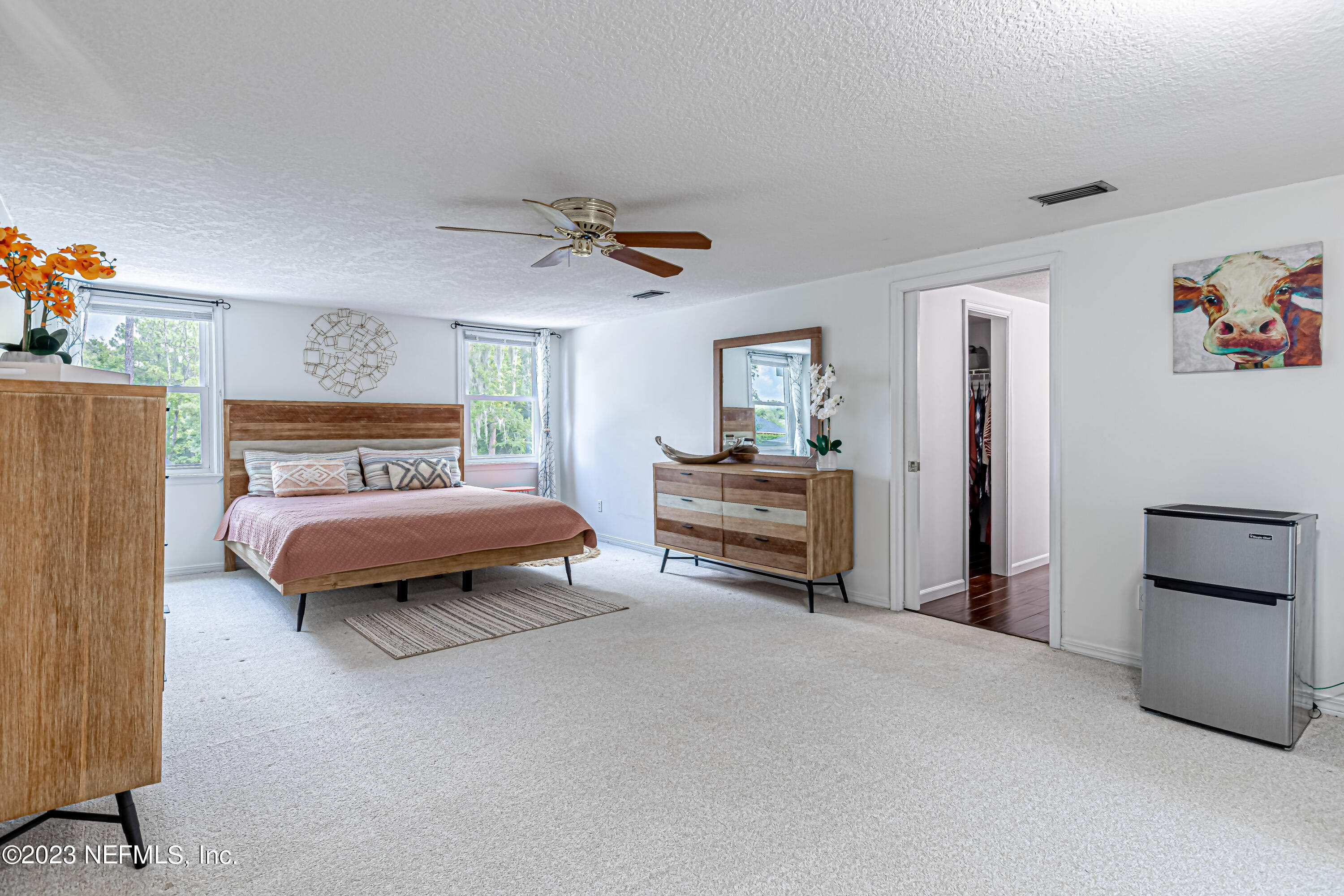 520 Roberts Road St. Johns, FL 32259 - Photo 28 of 81 a bedroom with a bed and a chandelier