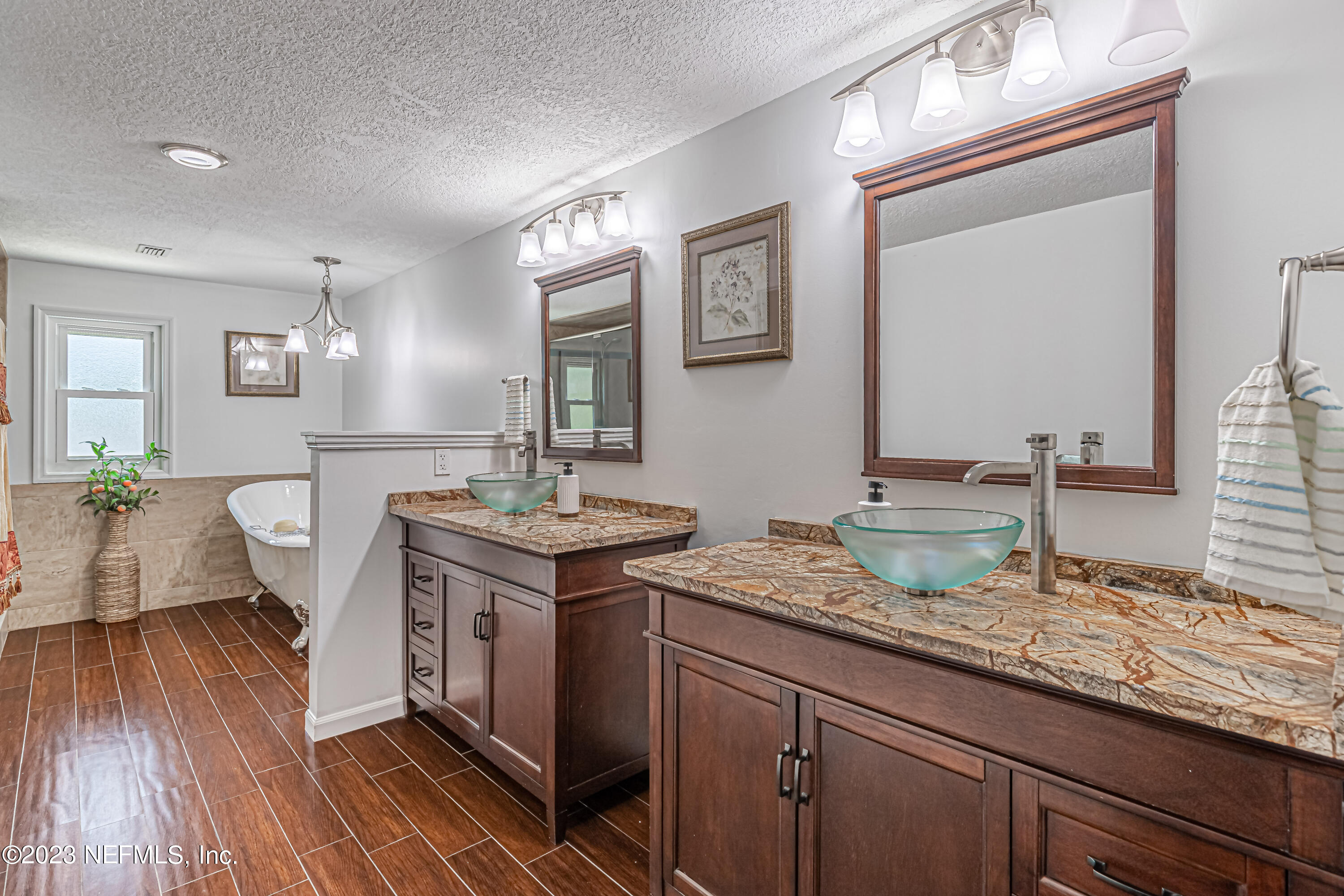 520 Roberts Road St. Johns, FL 32259 - Photo 33 of 81 a spacious bathroom with a granite countertop sink a mirror and a toilet