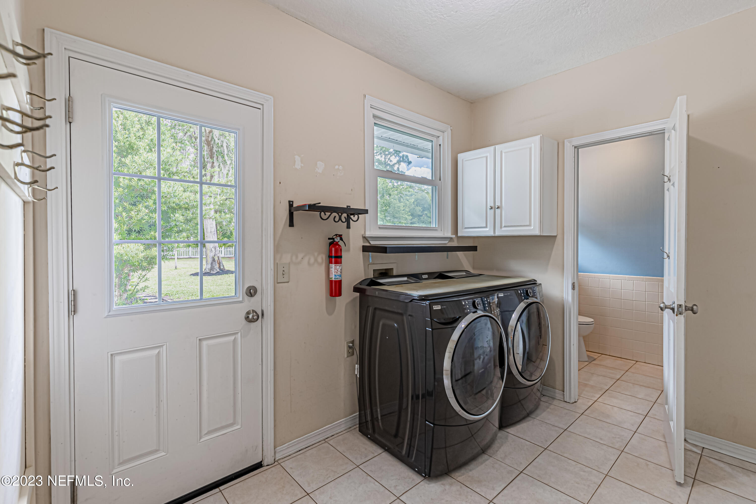 520 Roberts Road St. Johns, FL 32259 - Photo 42 of 81 a utility room with dryer and washer