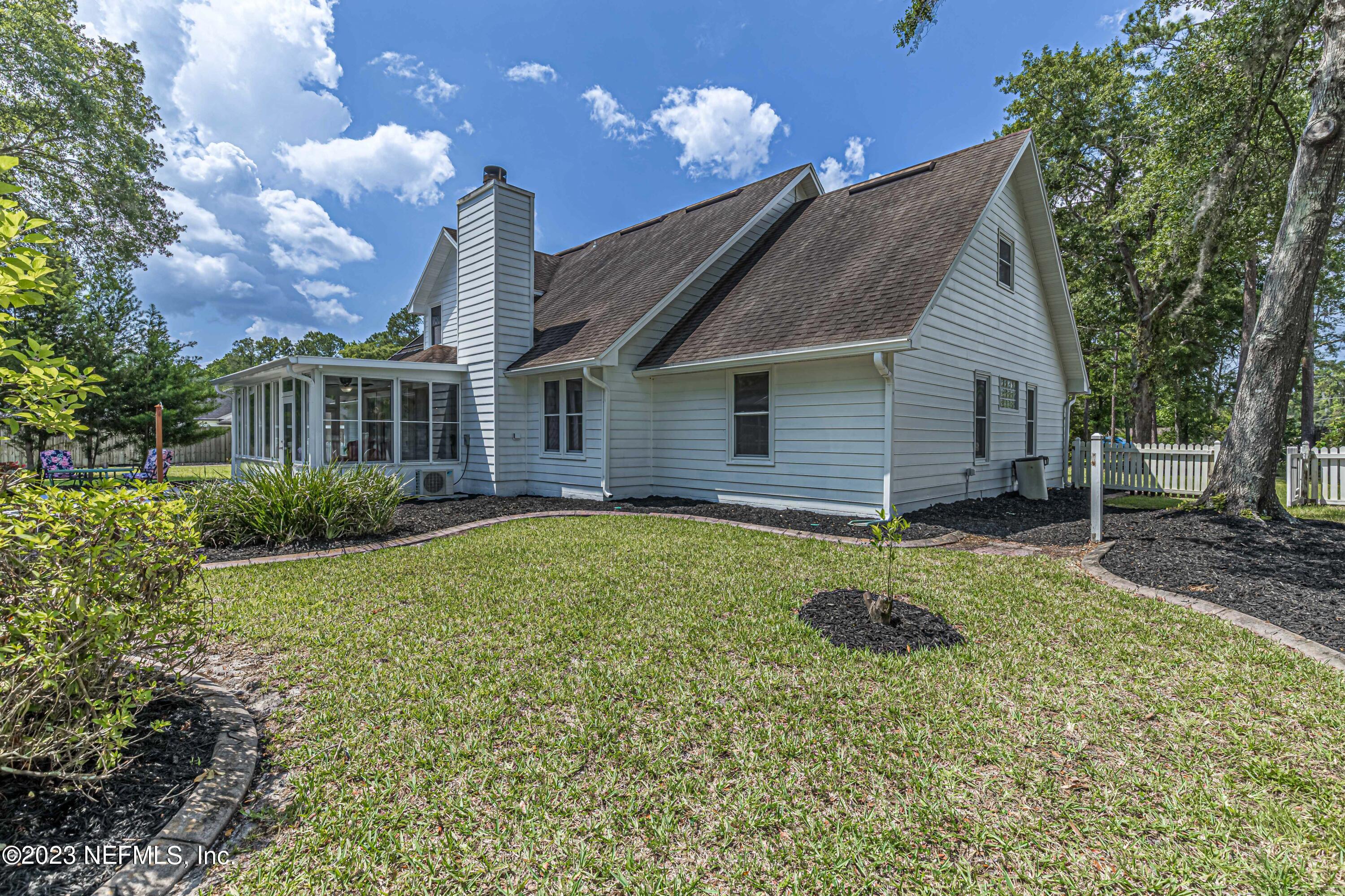520 Roberts Road St. Johns, FL 32259 - Photo 57 of 81 a backyard of a house with plants and outdoor seating