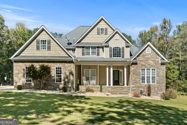 a front view of a house with a yard
