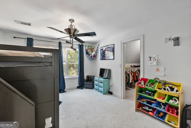 a spacious bathroom with a granite countertop sink mirror and shower