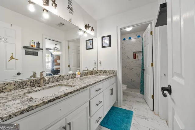 a bedroom with furniture and a bed