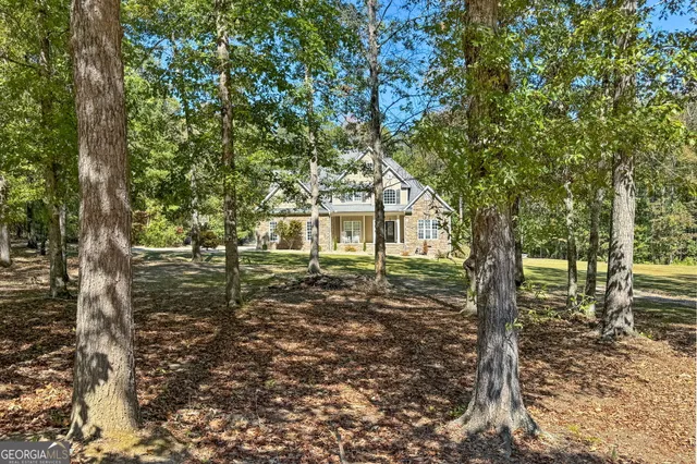 a view of a deck with wooden floor and seating space