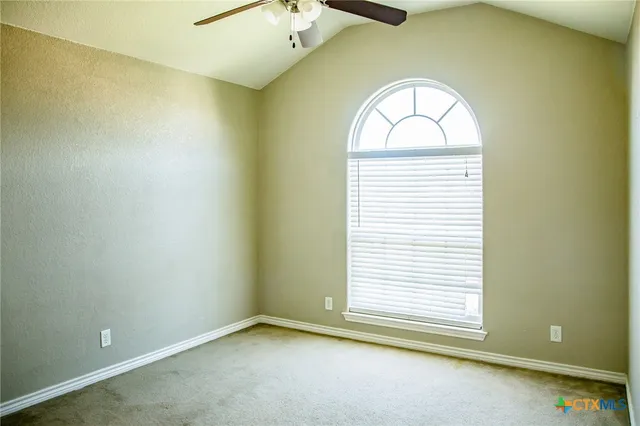 an empty room with closet area