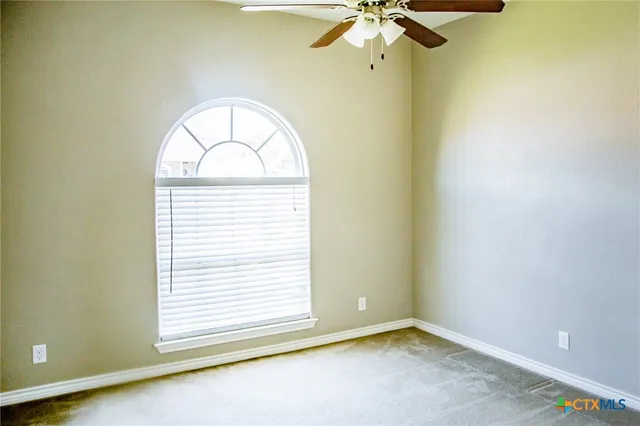 an empty room with closet area