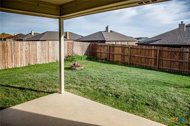 a view of a backyard with a garden