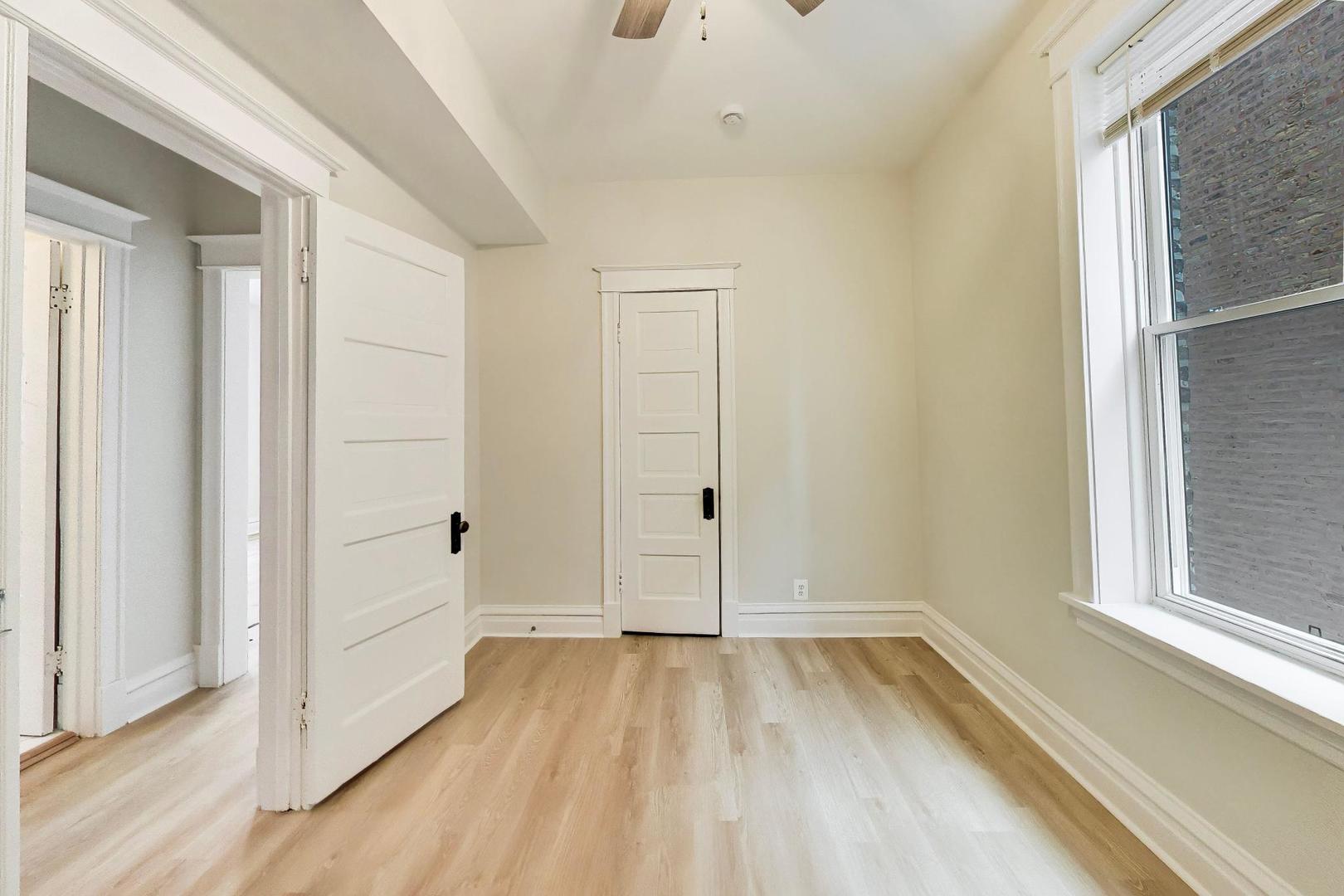 1646 West Byron Street, Unit 2F Chicago, IL 60613 - Photo 19 of 27 a view of a room with wooden floor and window