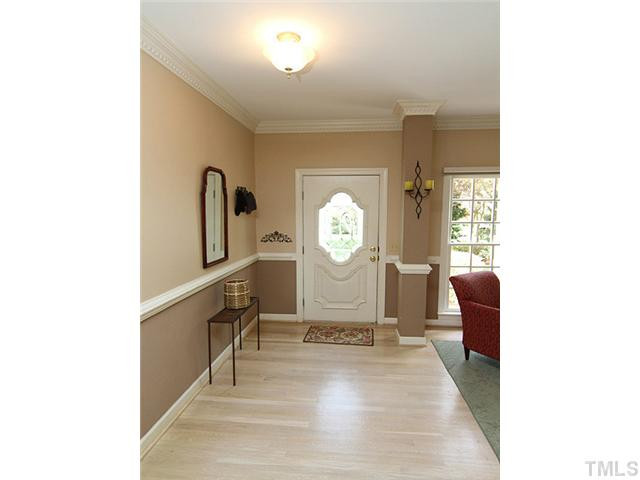 5101 Talton Circle Raleigh, NC 27612 - Photo 3 of 25 Bright foyer with crown molding, chair rail and wood floors. Foyer