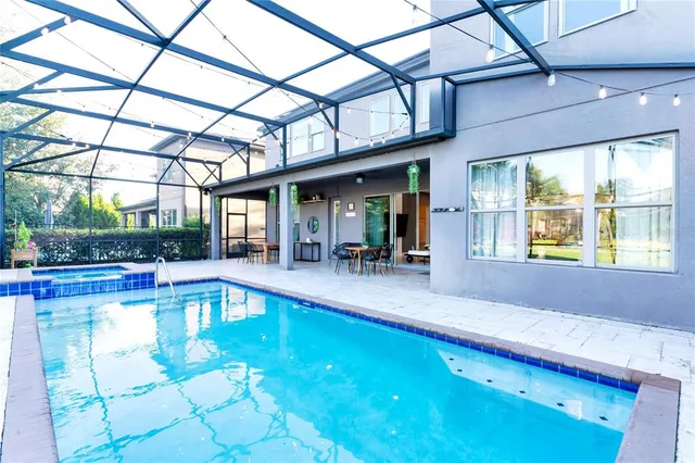 a view of a swimming pool with a patio