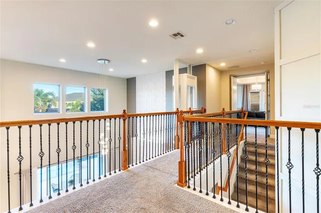 a view of a hallway with windows