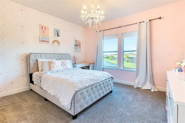 a en suite bathroom with a double vanity sink and a mirror