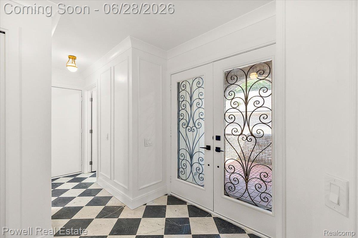 1447 Ravineview Court, Unit C12 Bloomfield Hills, MI 48304 - Photo 27 of 49 Entryway featuring double doors with decorative wrought iron inserts and black hardware
