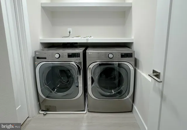 a utility room with dryer and washer