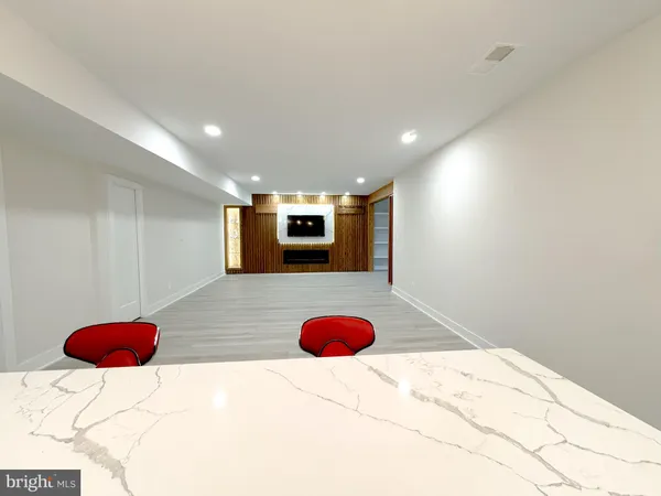 a view of kitchen island with wooden floor