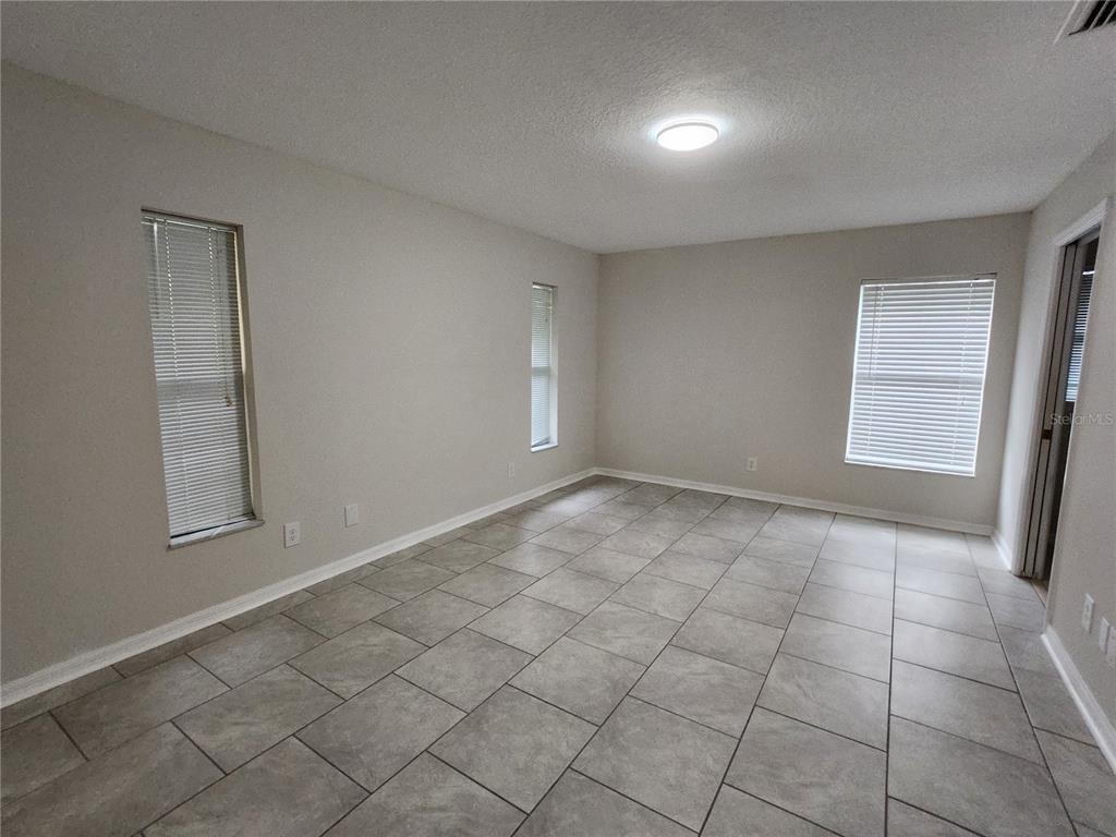 6521 East Grayson Street Inverness, FL 34452 - Photo 8 of 16 an empty room with windows