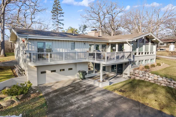 a view of a building with a lot of chairs and hanging chair