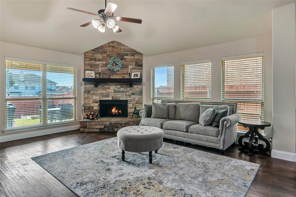 629 Fox View Drive Fort Worth, TX 76131 - Photo 15 of 38 a living room with furniture a window and a fireplace