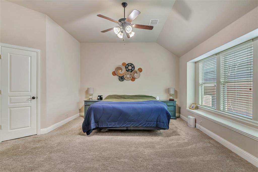 629 Fox View Drive Fort Worth, TX 76131 - Photo 20 of 38 a spacious bedroom with a bed and a window