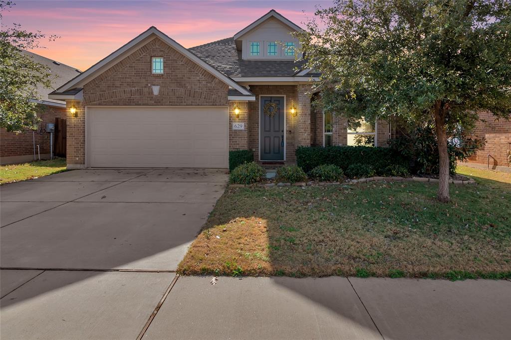629 Fox View Drive Fort Worth, TX 76131 - Photo 38 of 38 a front view of a house with a yard and garage
