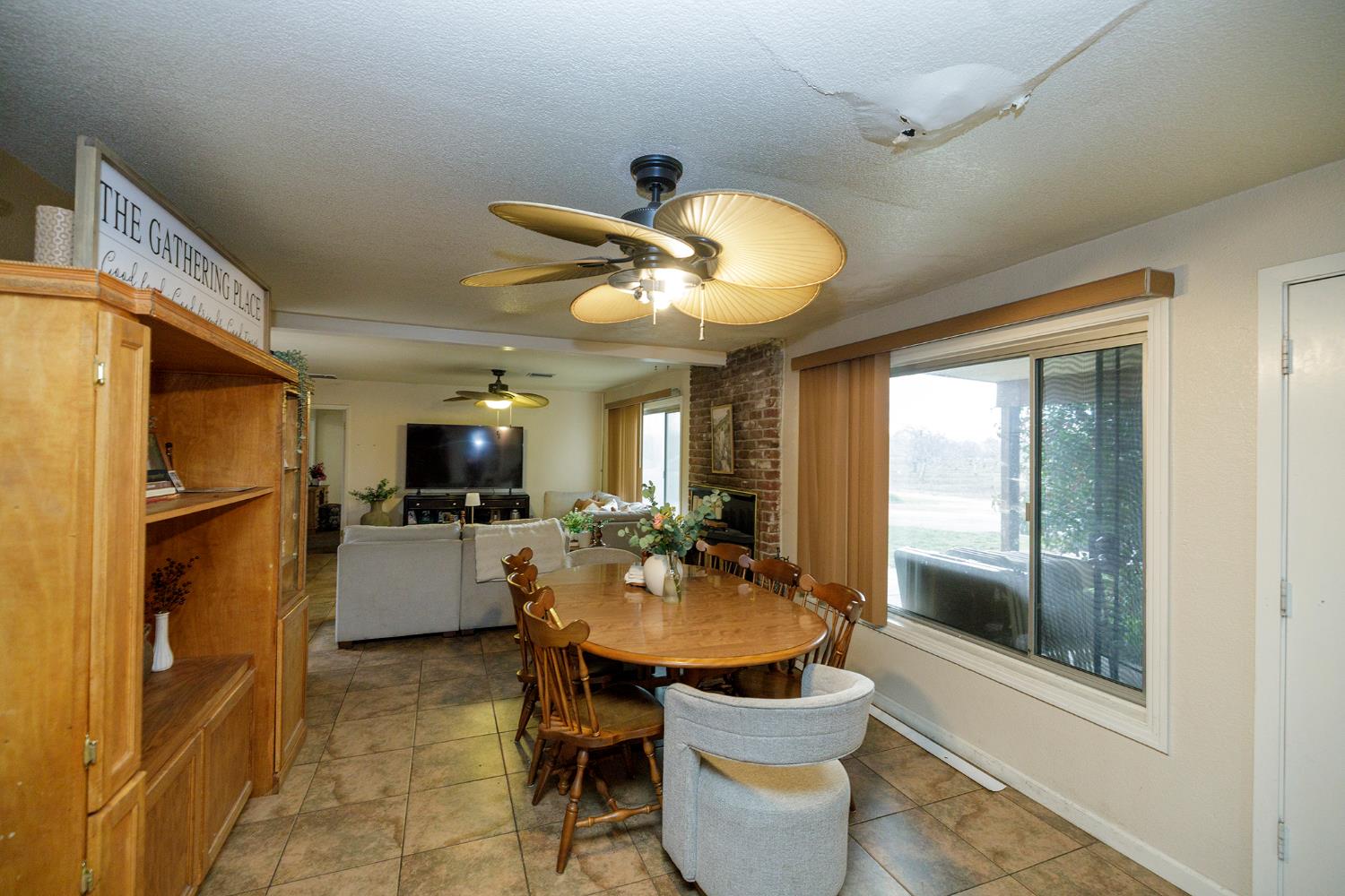 618 Wellsford Road Modesto, CA 95357 - Photo 12 of 26 a view of a dining room with furniture window and outside view