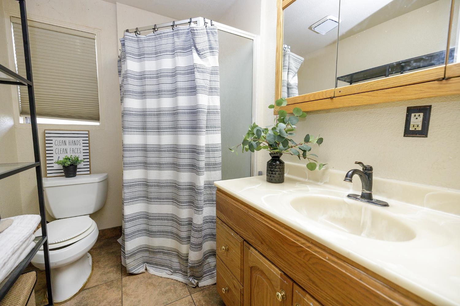 618 Wellsford Road Modesto, CA 95357 - Photo 21 of 26 a bathroom with a sink toilet and shower
