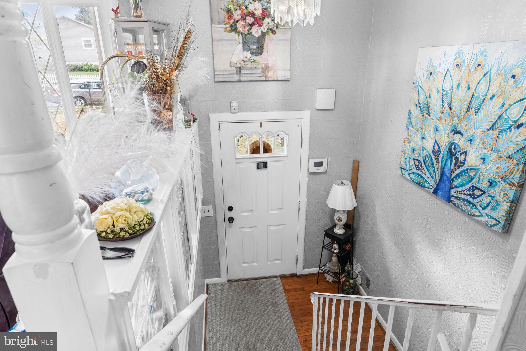 6816 Pepper Street Capitol Heights, MD 20743 - Photo 2 of 12 Inviting entryway with vibrant art.