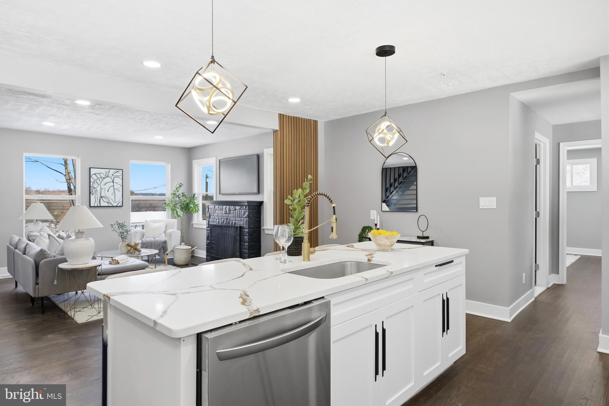 3170 Sykesville Road Westminster, MD 21157 - Photo 13 of 37 a kitchen with a sink a chandelier and living room view