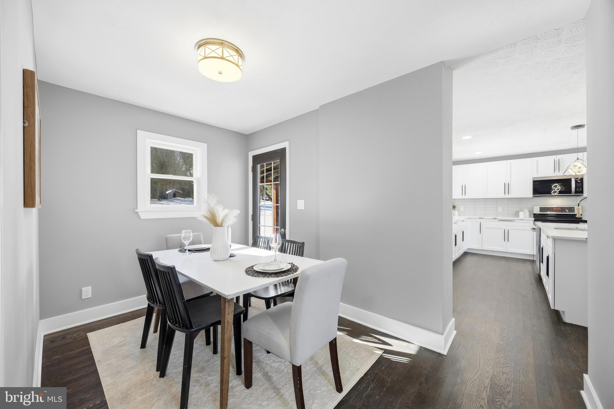 3170 Sykesville Road Westminster, MD 21157 - Photo 16 of 37 a view of a dining room with furniture and wooden floor