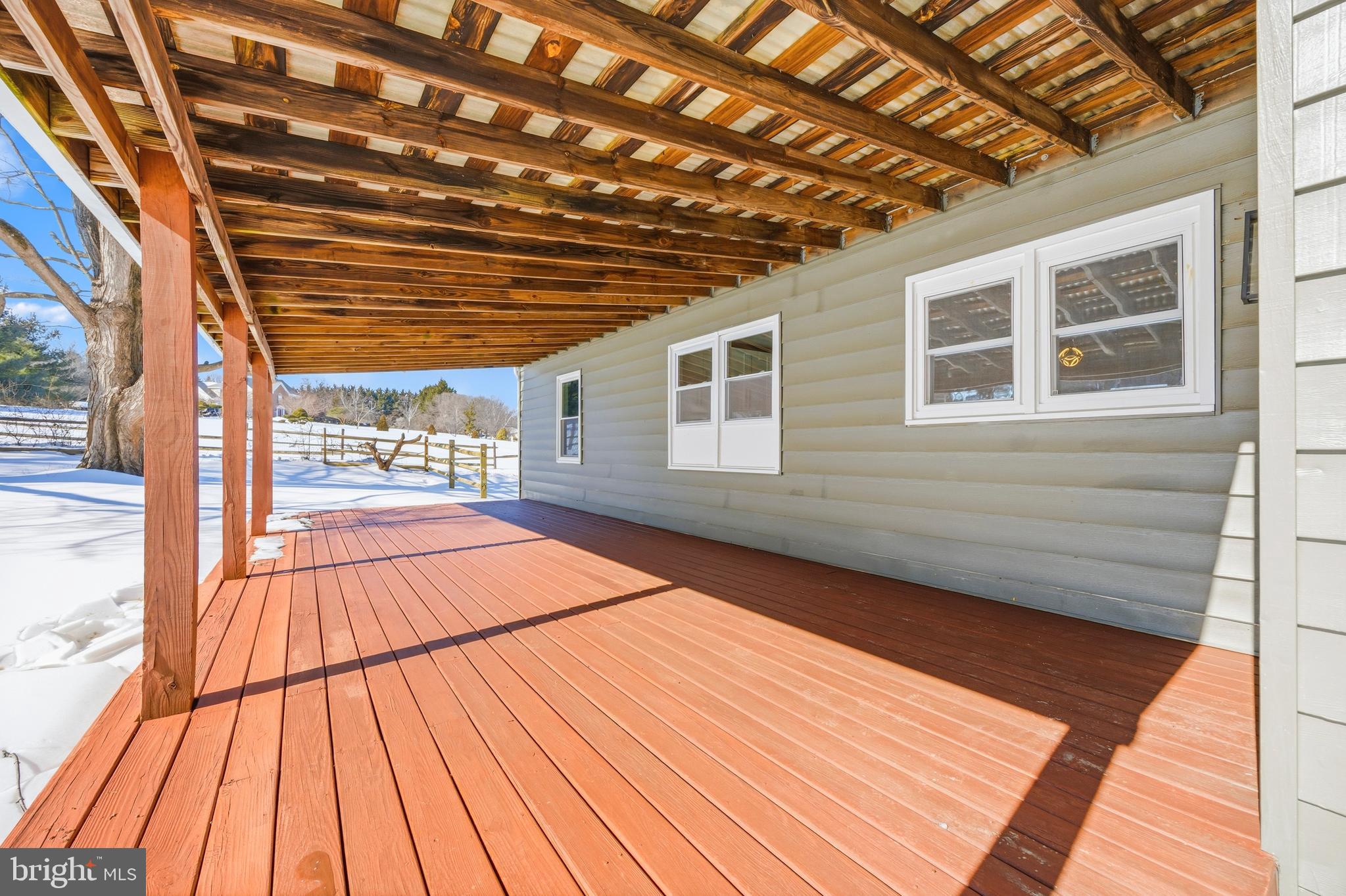 3170 Sykesville Road Westminster, MD 21157 - Photo 34 of 37 a view of backyard with a large window with wooden floor