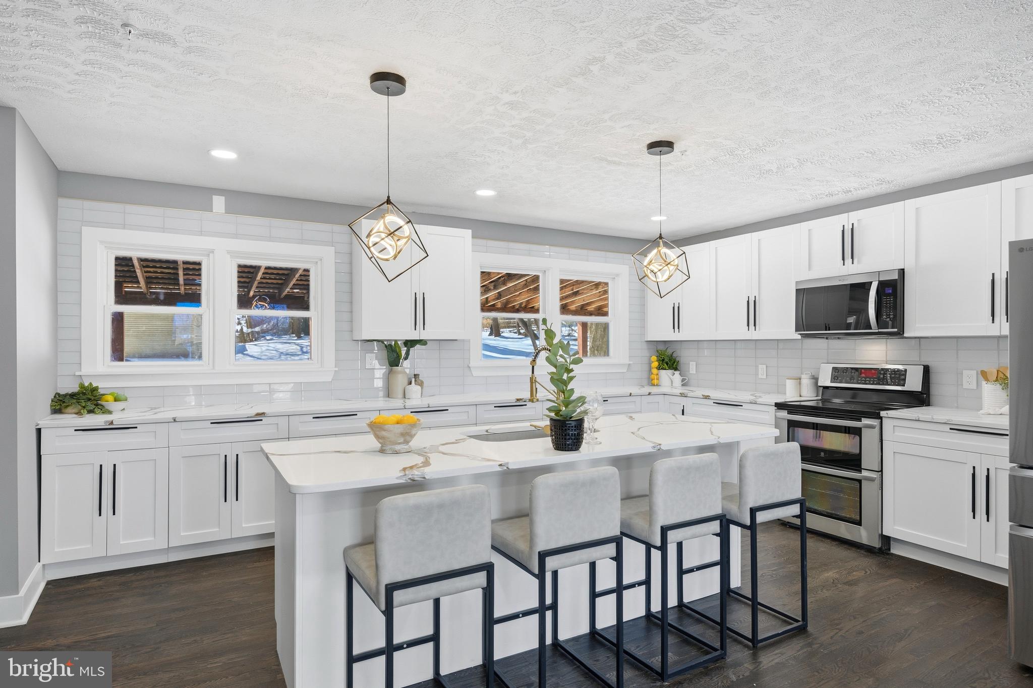 3170 Sykesville Road Westminster, MD 21157 - Photo 9 of 37 a kitchen with a dining table chairs sink and cabinets