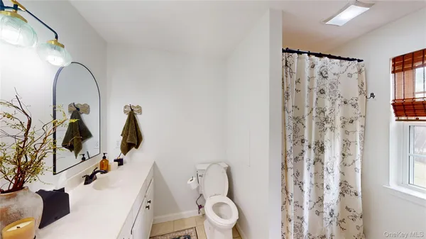 a view of a living room and bathroom