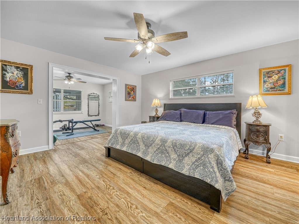 5342 Lime Road Sebring, FL 33875 - Photo 17 of 47 MASTER SUITE PROVIDES BOTH FUNCTIONALITY AND FLEXIBILITY WITH A DEDICATED OFFICE/NURSERY/GYM CONVENIENTLY OFF THE MASTER BEDROOM